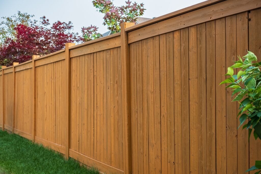 Nice,Wooden,Fence,Around,House.,Wooden,Fence,With,Green,Lawn.